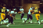 WSU Warrior Football Action Photograph 2002. This image was documented as a scan of a negative. by Winona State University