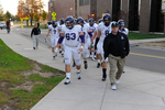 WSU Warrior Football Game 2010: Coach Tom Sawyer Walking with His Players by Winona State University and Andrew Nyhus